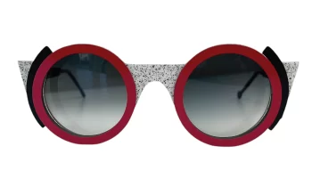 Nina Mûr 'Nathalie' wood sunglass frame in decori minimi with red and black accents. Designed and made in Madrid, Spain.