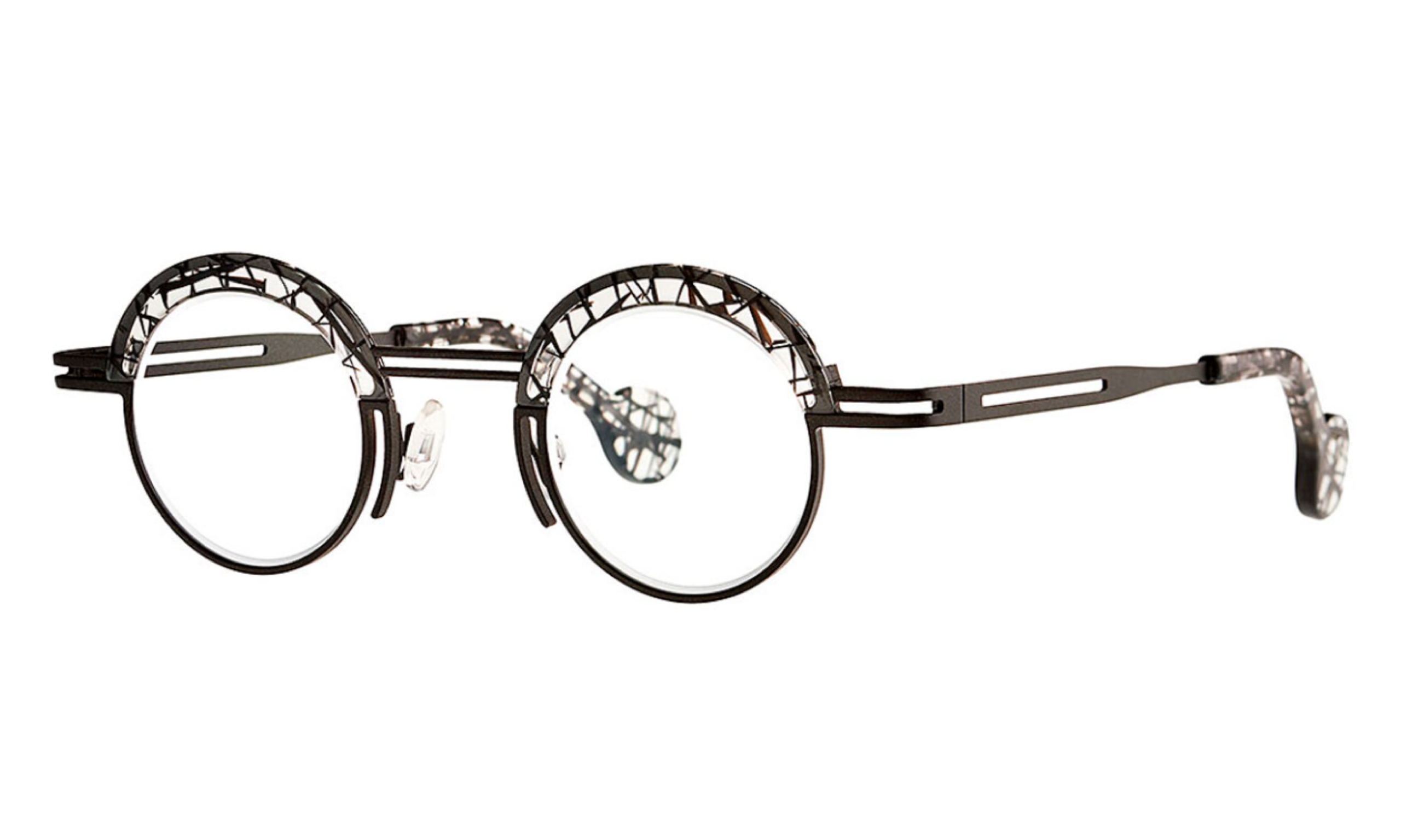 Theo brand eyeglasses in color black, roundish, titanium with crystal patterned acetate detailing.