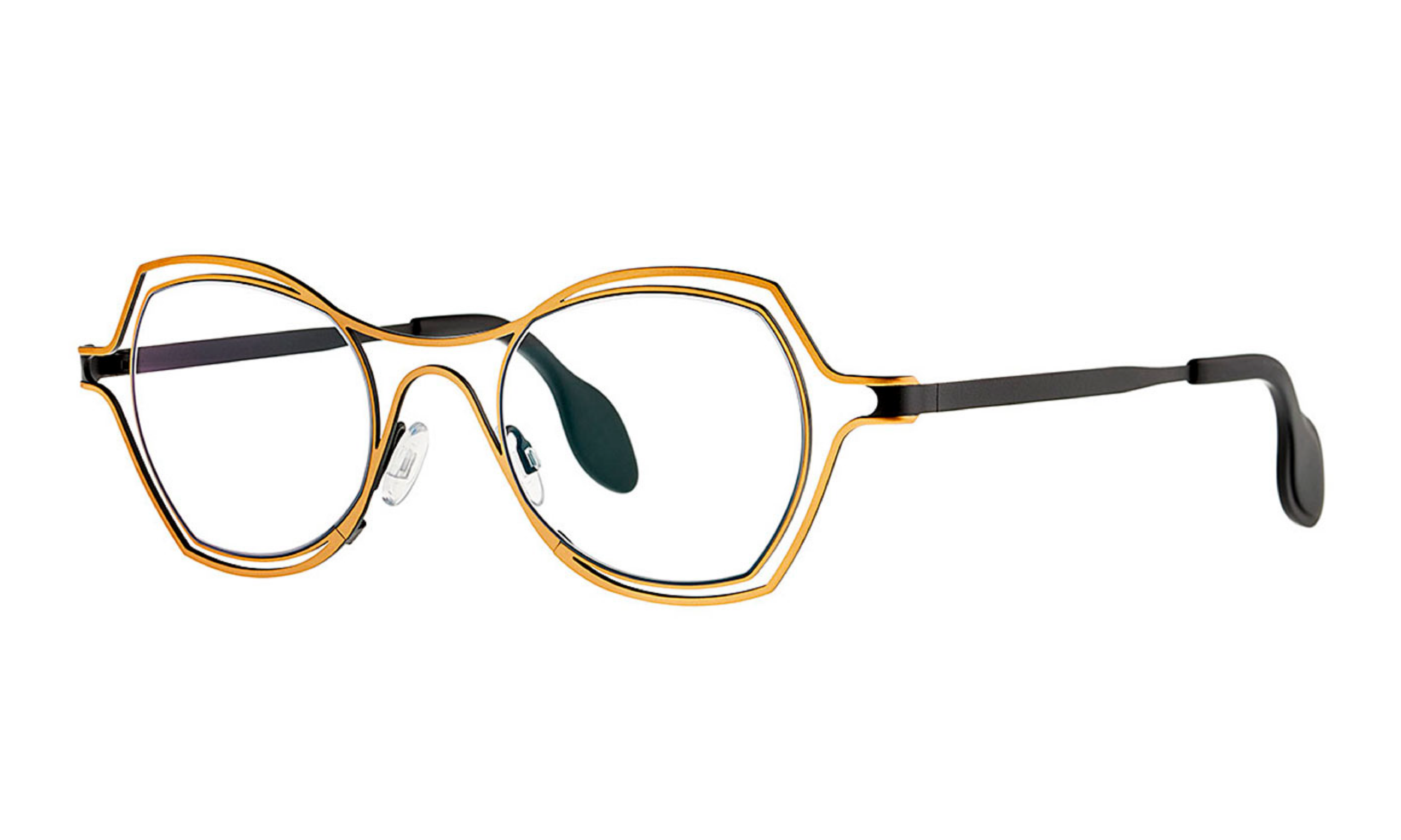 Theo brand eyeglasses in color shiny gold, inner side black. Stainless steel, lenses square-ish.