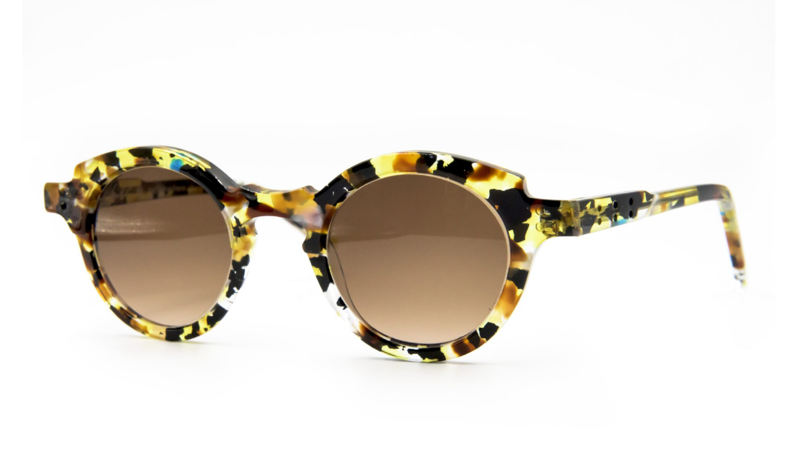 Faniel 'Pelleas' recycled acetate sunglass frame of black, translucent yellow and white. Non polarized gray lenses. Made in Quebec.